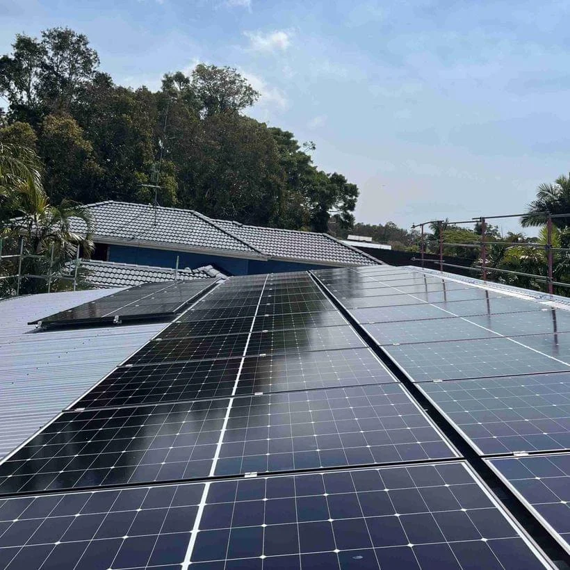 Solar installer working on a coastal roof in northern New South Wales